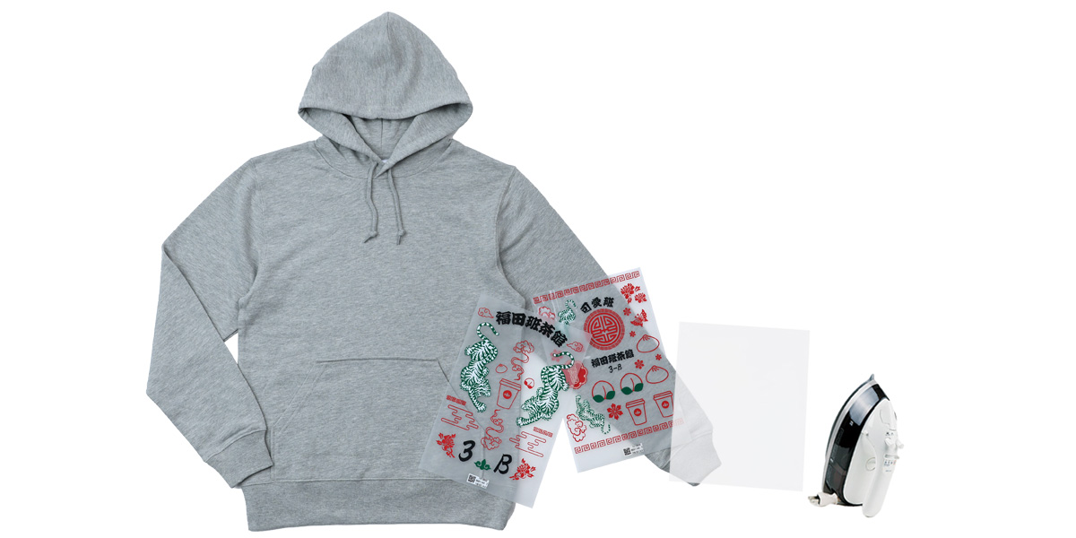 無地Tシャツの上に転写フィルムをちょっとずらして載せる＋アイロンとクッキングシート
